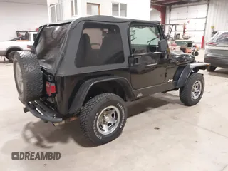 2002 Jeep Wrangler Sport with VIN 1J4FA49S02P704741, listed as a IAAI auction lot 41759558 with 191,126 mi miles. Bid and sale history available at carsss.com. Image 4.