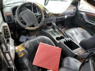 1999 Jeep Grand Cherokee Limited with VIN 1J4G268S2XC756532, listed as a Copart auction lot 71222174 with 279,300 mi miles and Salvage title. Bid and sale history available at DreamBid. Image 8.