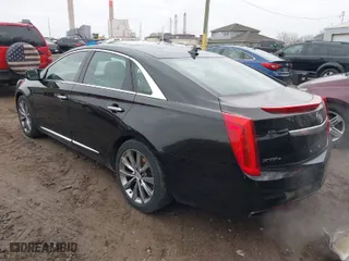 2013 Cadillac XTS Luxury with VIN 2G61R5S31D9221345, listed as a IAAI auction lot 41547095 with 148,070 mi miles. Bid and sale history available at carsss.com. Image 3.