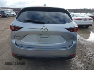2020 Mazda CX-5 Touring with VIN JM3KFACM5L0768371, listed as a IAAI auction lot 41862623 with 138,446 mi miles and . Bid and sale history available at carsss.com. Image 16.