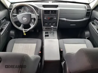 2010 Jeep Liberty Sport with VIN 1J4PP2GK9AW133958, listed as a Copart auction lot 47265675 with 124,466 mi miles and Salvage Title. Bid and sale history available at DreamBid. Image 8.
