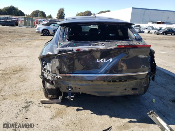 2023 Kia EV6 Wind with VIN KNDC34LA1P5609899, listed as a Copart auction lot 70710494 with 42,873 mi miles and Salvage Title. Bid and sale history available at carsss.com. Image 6.