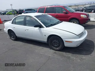 1998 Saturn SL z VIN 1G8ZJ5272WZ312413, wystawiony jako IAAI lot #41874493 z przebiegiem 229 200 mil mil oraz . Historia ofert i sprzedaży dostępna na DreamBid. Obrazek 1.