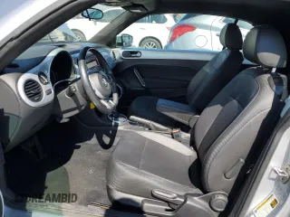 2015 Volkswagen Beetle 1.8T with VIN 3VW517AT8FM810709, listed as a Copart auction lot 48065314 with 61,924 mi miles and Salvage Title. Bid and sale history available at DreamBid. Image 7.