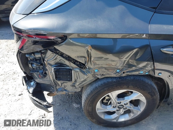 2022 Hyundai Tucson SEL with VIN 5NMJB3AEXNH144592, listed as a IAAI auction lot 42037487 with 75,651 mi miles and . Bid and sale history available at DreamBid. Image 6.