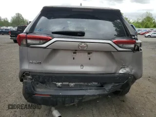 2019 Toyota RAV4 LE with VIN JTMG1RFV4KD004180, listed as a Copart auction lot 57127095 with 71,454 mi miles and Salvage title. Bid and sale history available at DreamBid. Image 6.
