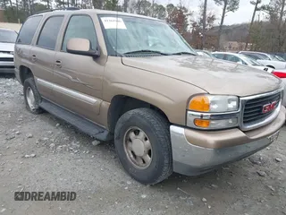 2003 GMC Yukon SLT with VIN 1GKEC13T73R126739, listed as a IAAI auction lot 41361906 with 166,748 mi miles. Bid and sale history available at carsss.com. Image 1.