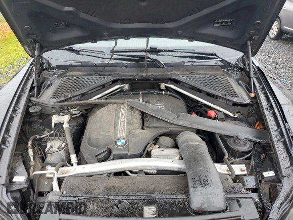 2012 BMW X5 35i with VIN 5UXZV4C57CL765053, listed as a Copart auction lot 59997275 with 157,943 mi miles and Salvage title. Bid and sale history available at DreamBid. Image 12.