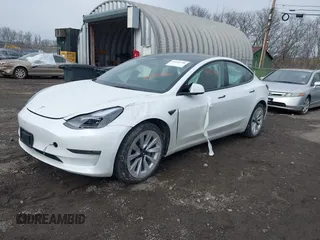 2023 Tesla Model 3 Long Range with VIN 5YJ3E1EB8PF600291, listed as a IAAI auction lot 41651156 with 37,055 mi miles and . Bid and sale history available at DreamBid. Image 2.