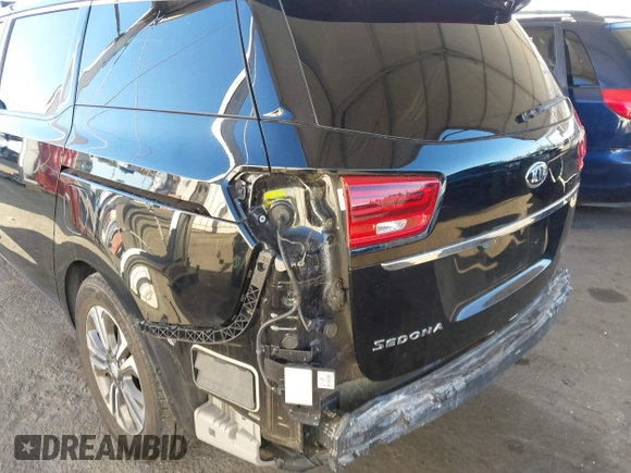 2021 Kia Sedona EX with VIN KNDMC5C10M6671729, listed as a IAAI auction lot 40858206 with 58,775 mi miles. Bid and sale history available at carsss.com. Image 6.