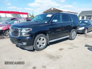 2015 Chevrolet Tahoe LTZ z VIN 1GNSKCKC3FR104845, wystawiony jako IAAI lot #42291785 z przebiegiem 75 047 mil mil oraz . Historia ofert i sprzedaży dostępna na DreamBid. Obrazek 2.