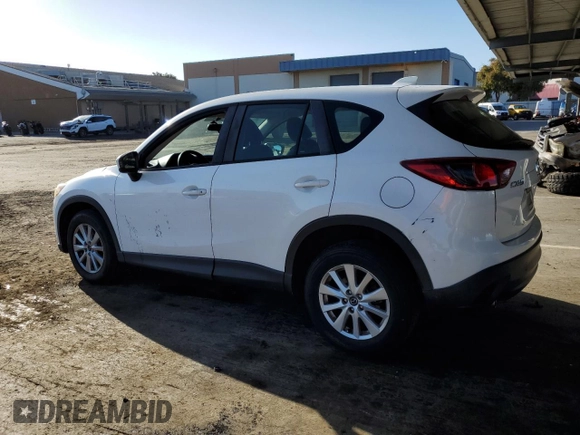 2013 Mazda CX-5 Sport with VIN JM3KE2BE7D0148951, listed as a Copart auction lot 57782115 with 65,677 mi miles and Salvage title. Bid and sale history available at DreamBid. Image 2.