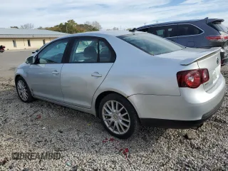 2008 Volkswagen Jetta Wolfsburg Edition z VIN 3VWRJ71K98M189900, wystawiony jako Copart lot #77866404 z przebiegiem 143 209 mil mil oraz Czysty tytuł • Clean title. Historia ofert i sprzedaży dostępna na DreamBid. Obrazek 2.