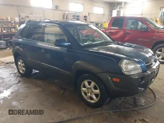 2005 Hyundai Tucson GLS with VIN KM8JN72DX5U076853, listed as a IAAI auction lot 41669853 with 164,241 mi miles. Bid and sale history available at carsss.com. Image 1.