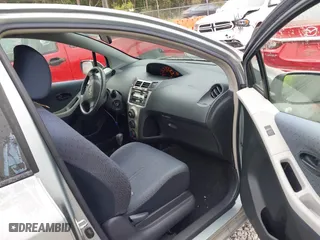 2010 Toyota Yaris with VIN JTDKT4K38A5296999, listed as a IAAI auction lot 41878127 with 122,692 mi miles. Bid and sale history available at carsss.com. Image 5.