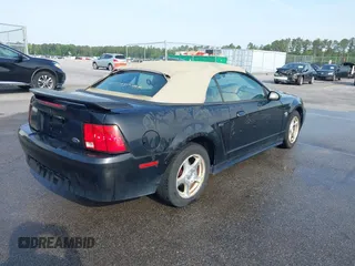 2004 Ford Mustang Deluxe with VIN 1FAFP446X4F187154, listed as a IAAI auction lot 42068363 with 125,074 mi miles. Bid and sale history available at carsss.com. Image 4.
