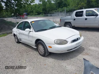 1996 Mercury Sable GS z VIN 1MELM50U4TG650767, wystawiony jako IAAI lot #42673567 z przebiegiem 179 981 mil mil oraz . Historia ofert i sprzedaży dostępna na DreamBid. Obrazek 1.