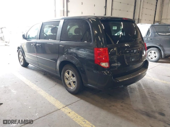 2013 Dodge Grand Caravan SXT with VIN 2C4RDGCG7DR523945, listed as a IAAI auction lot 41730286 with 140,749 mi miles. Bid and sale history available at carsss.com. Image 3.