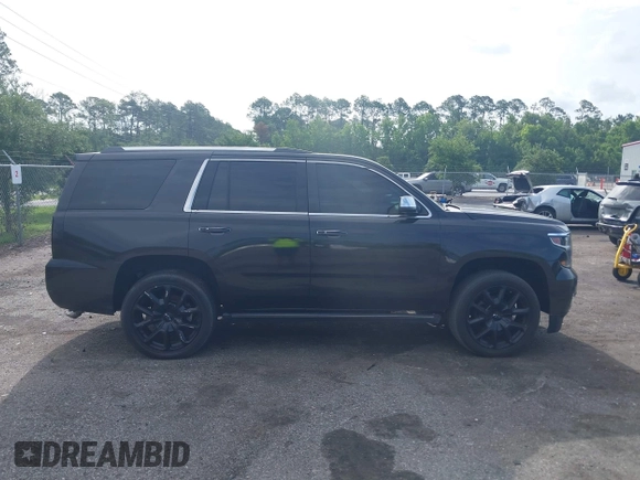 2015 Chevrolet Tahoe LTZ with VIN 1GNSCCKC5FR103676, listed as a IAAI auction lot 42456913 with 214,009 mi miles and . Bid and sale history available at DreamBid. Image 12.