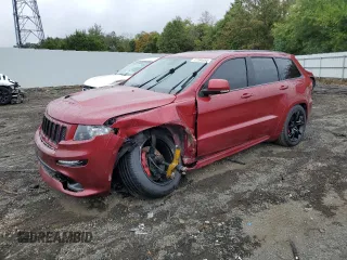 2012 Jeep Grand Cherokee SRT8 with VIN 1C4RJFDJ0CC351195, listed as a Copart auction lot 72794454 with 104,672 mi miles and Salvage Title. Bid and sale history available at carsss.com. Image 1.