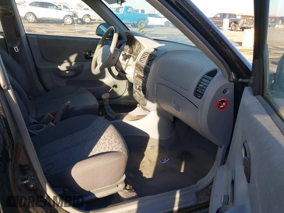 2005 Hyundai Accent GLS with VIN KMHCG45C75U632587, listed as a IAAI auction lot 40946829 with 114,666 mi miles. Bid and sale history available at carsss.com. Image 5.