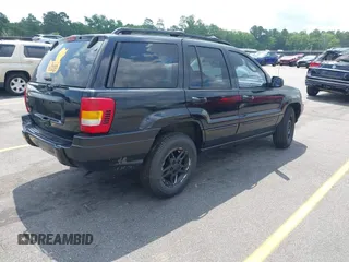 2002 Jeep Grand Cherokee Laredo with VIN 1J4GX48S42C313801, listed as a IAAI auction lot 42297223 with 153,633 mi miles and . Bid and sale history available at DreamBid. Image 4.