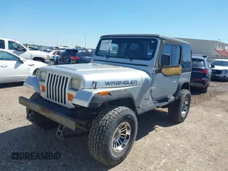1994 Jeep Wrangler S with VIN 1J4FY19P9RP438376, listed as a IAAI auction lot 41751057 with 165,407 mi miles. Bid and sale history available at carsss.com. Image 2.