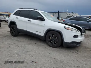 2017 Jeep Cherokee Altitude with VIN 1C4PJLAB2HW573567, listed as a Copart auction lot 59630205 with 105,975 mi miles and Salvage title. Bid and sale history available at DreamBid. Image 4.