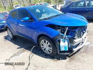 2020 Toyota C-HR LE with VIN JTNKHMBX7L1071287, listed as a IAAI auction lot 42063896 with 76,731 mi miles. Bid and sale history available at carsss.com. Image 1.