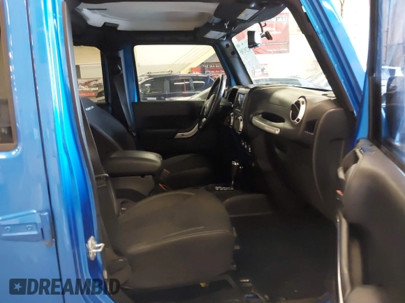 2015 Jeep Wrangler Unlimited Rubicon with VIN 1C4BJWFG7FL661643, listed as a IAAI auction lot 41291385 with 112,785 mi miles. Bid and sale history available at carsss.com. Image 5.