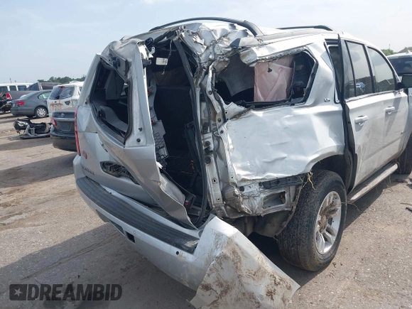 2016 Chevrolet Tahoe LS with VIN 1GNSCAEC2GR392937, listed as a IAAI auction lot 42648714 with 166,764 mi miles and . Bid and sale history available at DreamBid. Image 4.