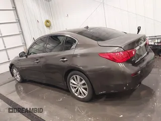 2015 Infiniti Q50 Premium z VIN JN1BV7ARXFM418280, wystawiony jako IAAI lot #42080879 z przebiegiem 126 411 mil mil oraz . Historia ofert i sprzedaży dostępna na DreamBid. Obrazek 14.