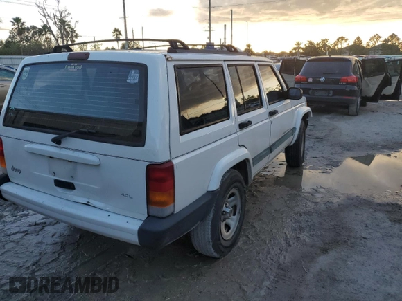 1999 Jeep Cherokee Sport with VIN 1J4FT68S6XL578679, listed as a Copart auction lot 76697394 with 196,110 mi miles and Salvage title. Bid and sale history available at DreamBid. Image 3.