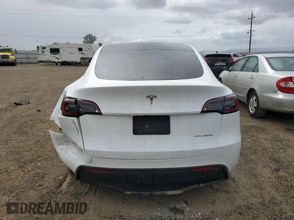 2023 Tesla Model Y Long Range z VIN 7SAYGAEE0PF693613, wystawiony jako Copart lot #54452895 z przebiegiem 19 574 mil mil oraz Szkoda całkowita • Salvage title. Historia ofert i sprzedaży dostępna na DreamBid. Obrazek 6.