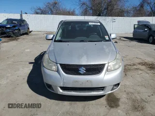 2011 Suzuki SX4 LE with VIN JS2YC5A27B6301040, listed as a Copart auction lot 47218805 with 106,474 mi miles and Salvage Title. Bid and sale history available at carsss.com. Image 5.