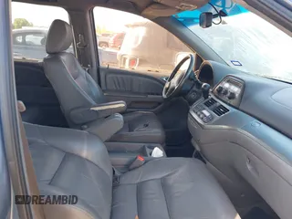 2009 Honda Odyssey EX-L with VIN 5FNRL38759B001130, listed as a IAAI auction lot 42004710 with 142,126 mi miles and . Bid and sale history available at DreamBid. Image 5.