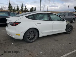 2021 Tesla Model 3 Standard Range Plus with VIN 5YJ3E1EA6MF066064, listed as a Copart auction lot 54063625 with 27,424 mi miles and Salvage Title. Bid and sale history available at DreamBid. Image 3.