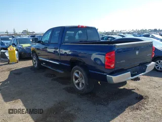 2007 Dodge 1500 SLT with VIN 1D7HU18207J606248, listed as a IAAI auction lot 42141047 with 128,821 mi miles. Bid and sale history available at carsss.com. Image 3.