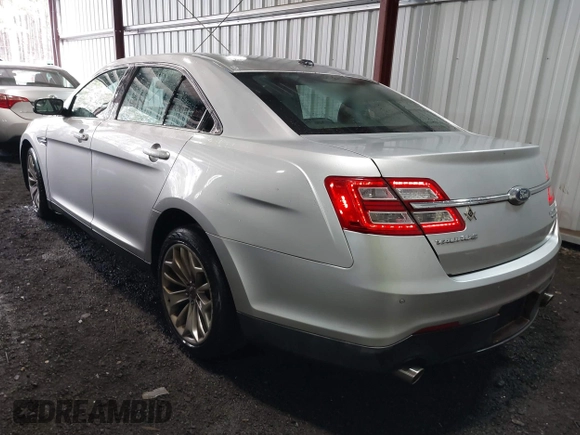 2014 Ford Taurus Limited with VIN 1FAHP2F81EG101351, listed as a IAAI auction lot 41662308 with 139,542 mi miles. Bid and sale history available at carsss.com. Image 3.