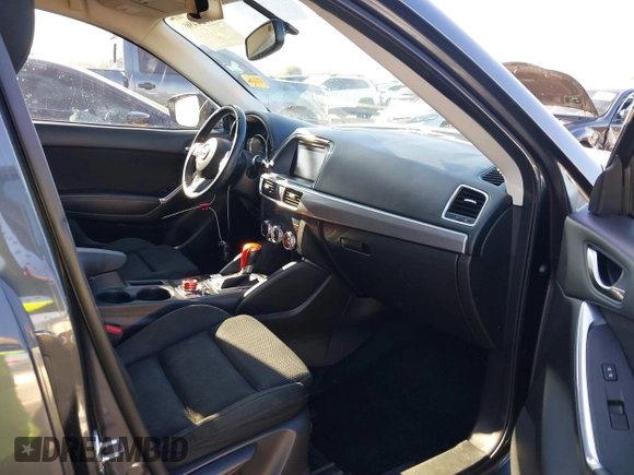 2016 Mazda CX-5 Touring with VIN JM3KE2CY4G0695947, listed as a IAAI auction lot 41824490 with 162,191 mi miles and . Bid and sale history available at carsss.com. Image 5.