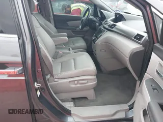 2016 Honda Odyssey Touring Elite with VIN 5FNRL5H96GB063176, listed as a IAAI auction lot 42157604 with 106,177 mi miles. Bid and sale history available at carsss.com. Image 5.