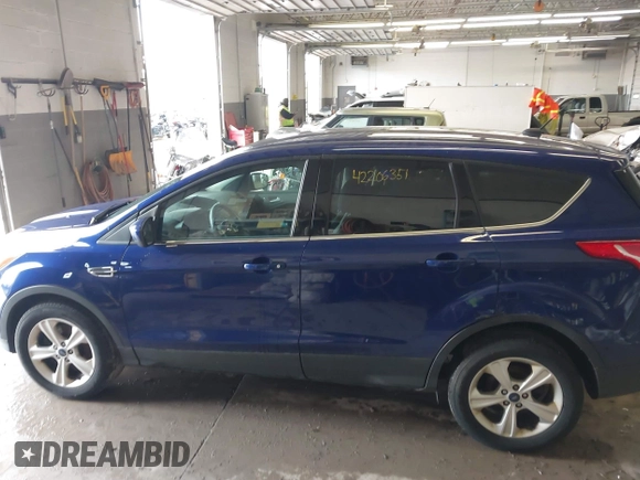 2016 Ford Escape SE with VIN 1FMCU9GX2GUA80134, listed as a IAAI auction lot 42206351 with 129,885 mi miles and . Bid and sale history available at DreamBid. Image 14.