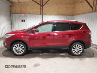 2017 Ford Escape Titanium z VIN 1FMCU9J9XHUC20359, wystawiony jako IAAI lot #41938688 z przebiegiem 79 743 mil mil oraz . Historia ofert i sprzedaży dostępna na DreamBid. Obrazek 14.