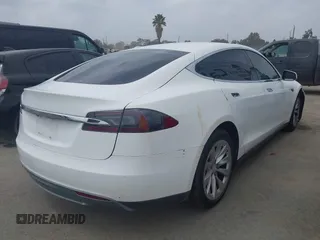 2014 Tesla Model S 60 with VIN 5YJSA1H16EFP32585, listed as a IAAI auction lot 42068925 with 119,561 mi miles and . Bid and sale history available at DreamBid. Image 4.