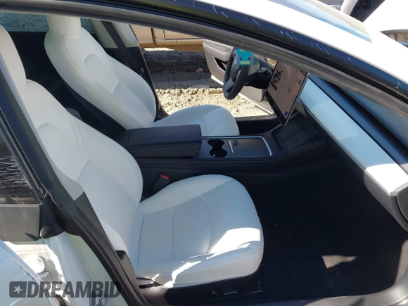 2023 Tesla Model 3 z VIN 5YJ3E1EA4PF482005, wystawiony jako IAAI lot #41363157 z przebiegiem 26 013 mil mil oraz . Historia ofert i sprzedaży dostępna na DreamBid. Obrazek 5.