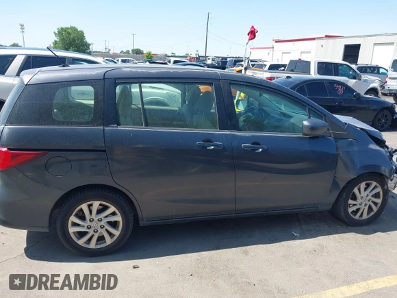 2012 Mazda 5 Sport with VIN JM1CW2BL1C0116150, listed as a IAAI auction lot 42571812 with 124,236 mi miles and . Bid and sale history available at DreamBid. Image 14.