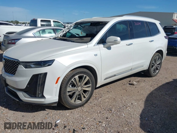 2021 Cadillac XT6 Premium Luxury z VIN 1GYKPCRS6MZ230499, wystawiony jako IAAI lot #41808404 z przebiegiem 86 933 mil mil oraz . Historia ofert i sprzedaży dostępna na DreamBid. Obrazek 2.