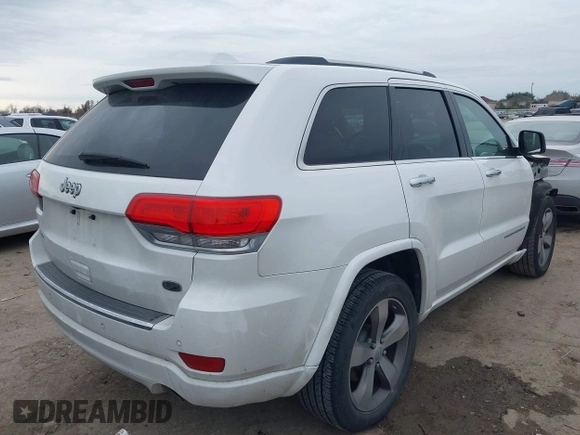 2014 Jeep Grand Cherokee Overland with VIN 1C4RJECG3EC266659, listed as a IAAI auction lot 41363419 with 142,896 mi miles. Bid and sale history available at carsss.com. Image 4.