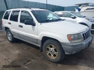 1999 Jeep Grand Cherokee Laredo with VIN 1J4GW58SXXC623404, listed as a IAAI auction lot 41838797 with 0 mi miles. Bid and sale history available at carsss.com. Image 1.