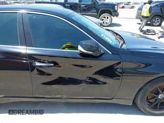 2015 Infiniti Q50 z VIN JN1BV7AP9FM335745, wystawiony jako IAAI lot #42336325 z przebiegiem 153 970 mil mil oraz . Historia ofert i sprzedaży dostępna na DreamBid. Obrazek 14.